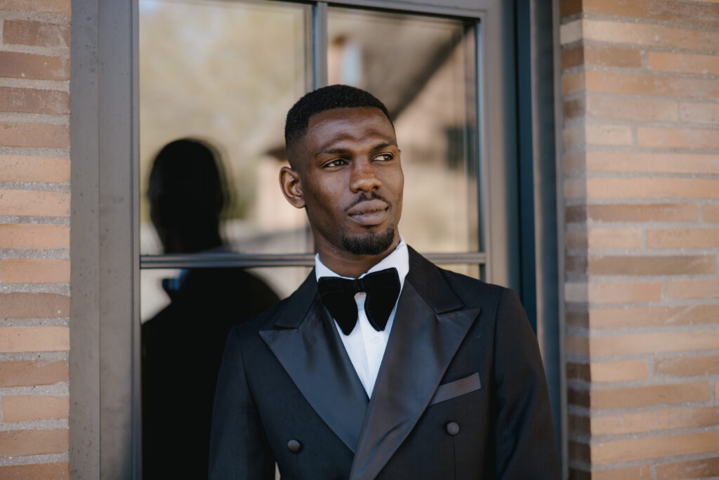 Daniel Osei Afrifa in a black tuxedo and bow tie